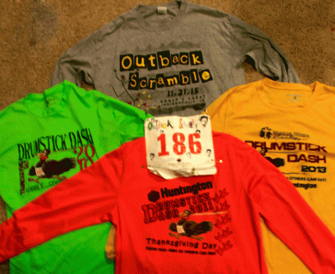 A few shirts and a bib from fundraising races in the past.