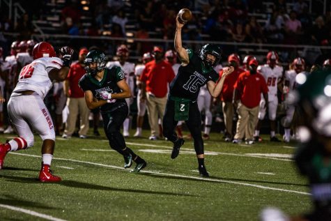 Andrew Broecker, quarterback, throws after faking a run with Nick Brier, running back.
Photo by: Alex Paul