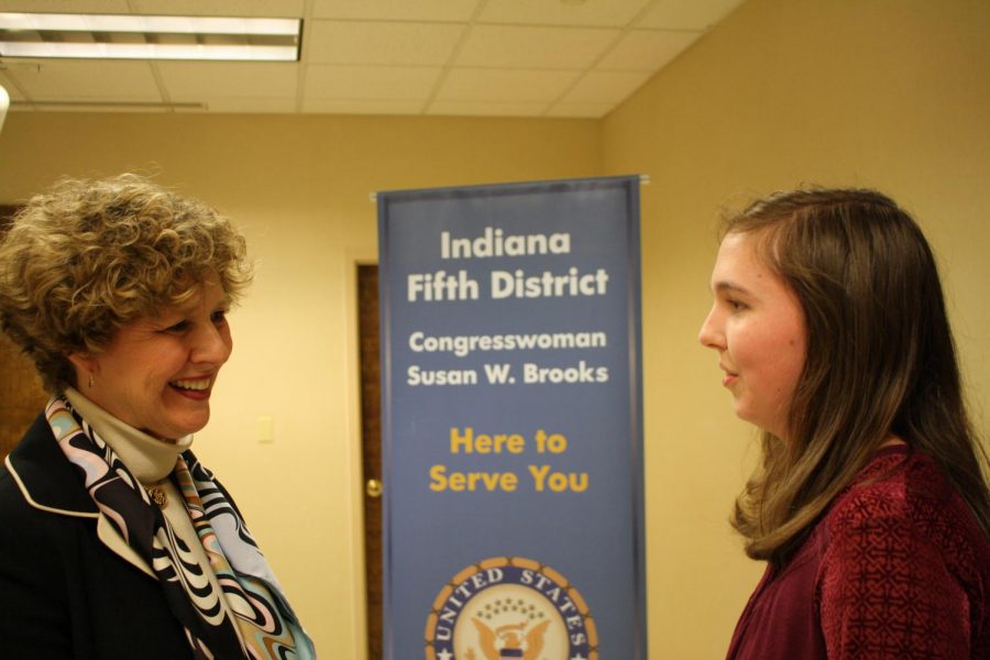Susan Brooks listens as senior Kelsey Merrill shares her opinions on gun control.