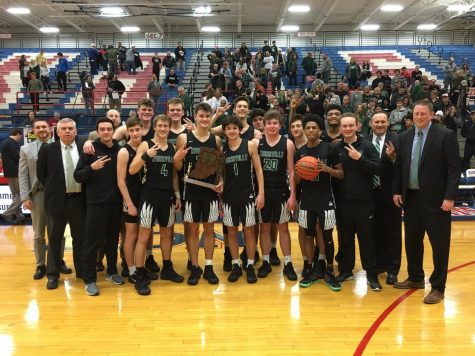 Photo provided by the Zionsville Boys Basketball twitter. The team celebrates their win Saturday night with the Sectional Seven trophy.